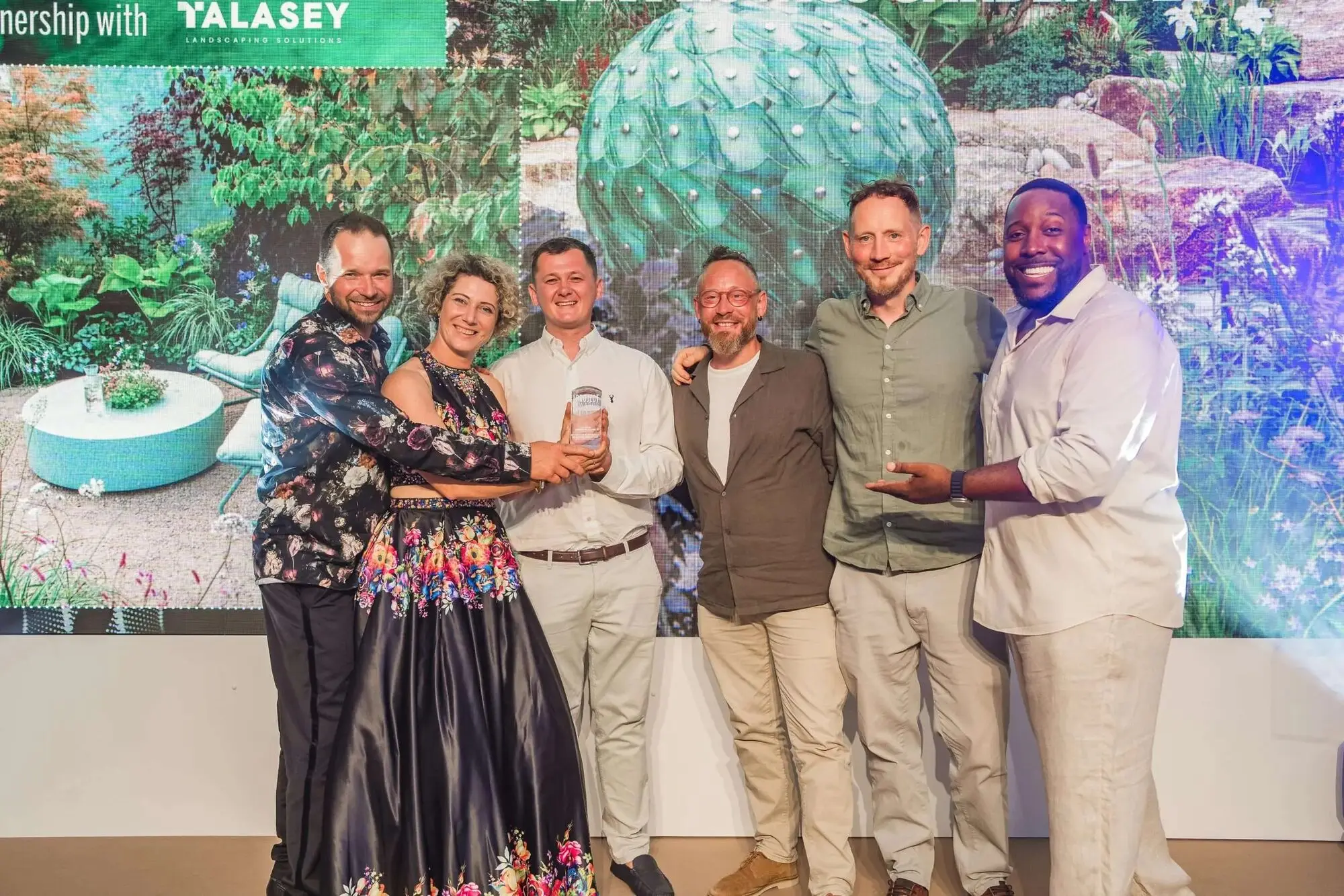Kitti Kovacs and the project team receiving a Pro Landscaper Project Award in 2026