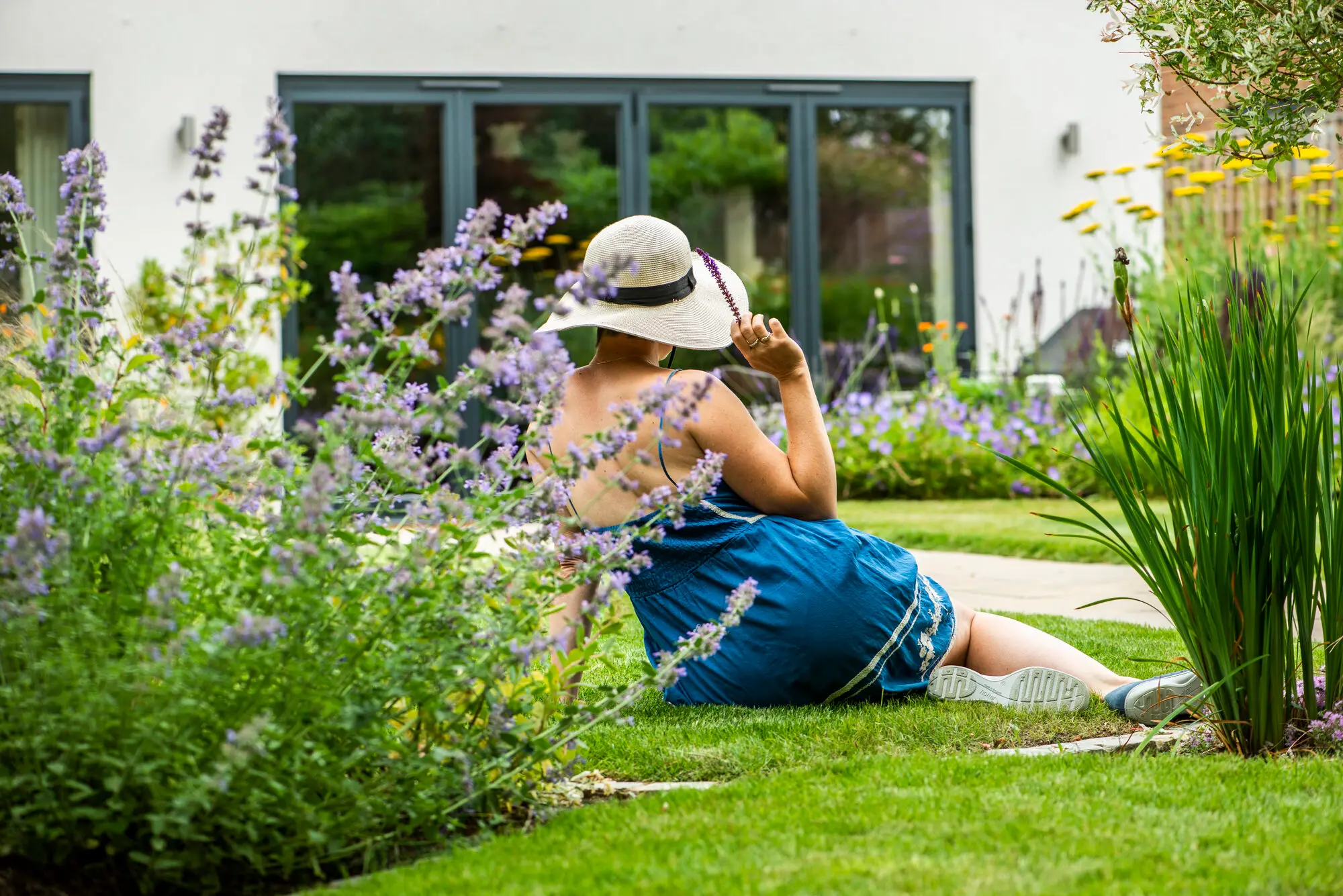 Kitti Kovacs enjoying a peaceful garden designed for wellbeing and connection with nature