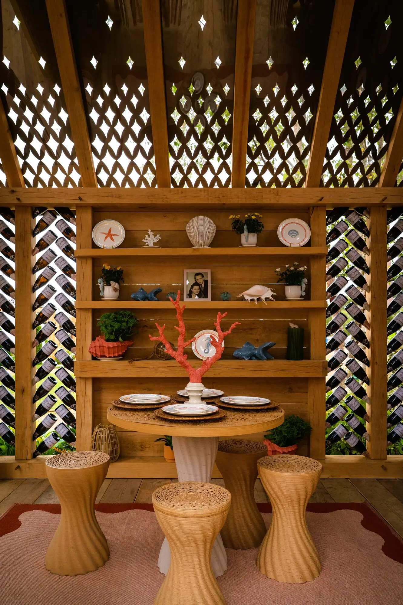 Oak garden building incorporating more than 400 recycled wine bottles in the 100 Sweet Summers show garden